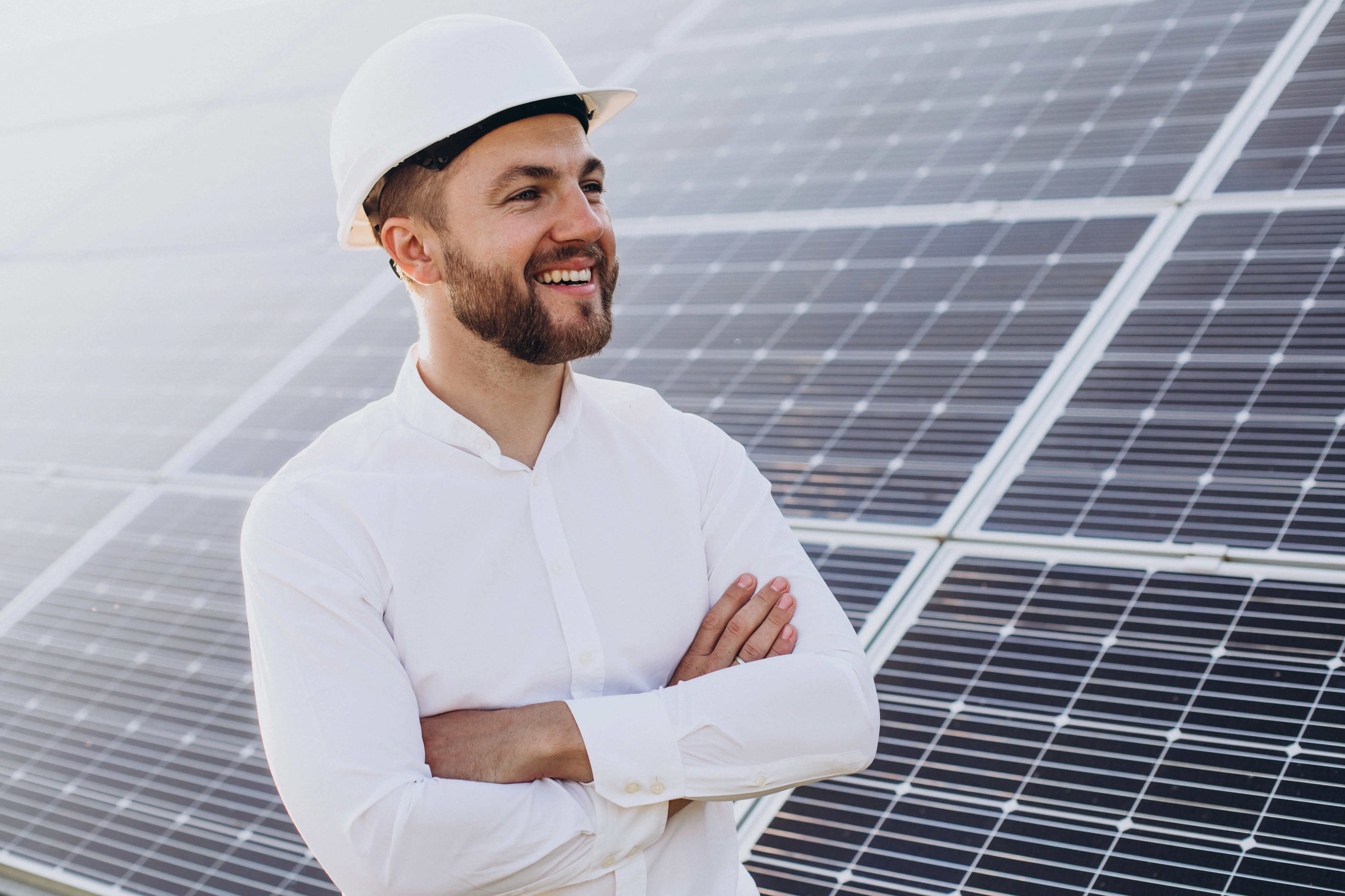  young-architect-standing-by-solar-panels.jpg 